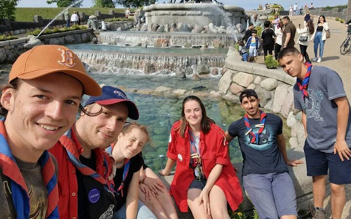 Group of tourists at Gefion Fountain, Copenhagen, during a self-guided city exploration game.