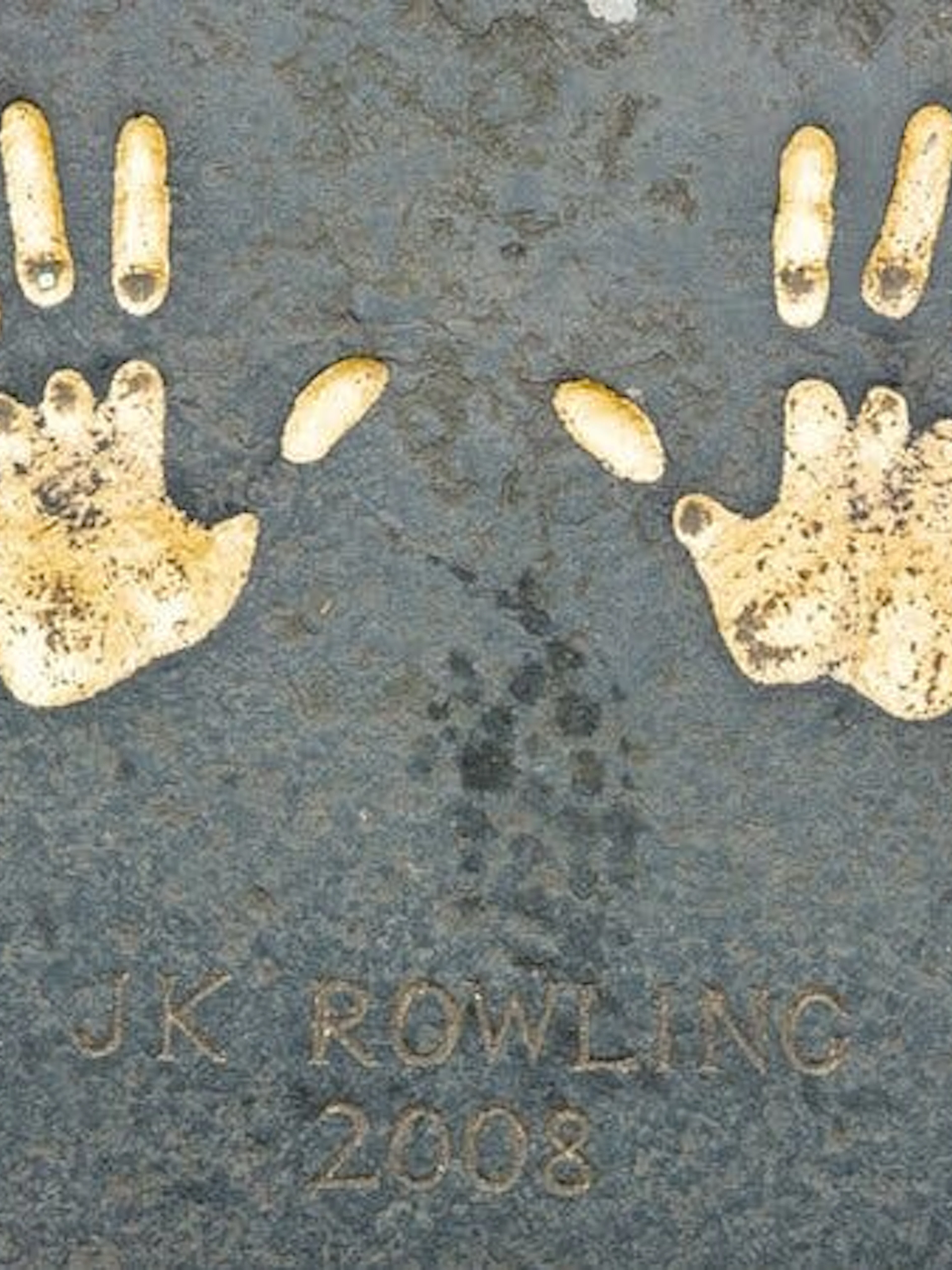 Handprints on Edinburgh pavement from 2008, part of city exploration game.
