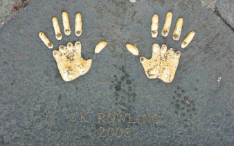 Handprints on Edinburgh pavement from 2008, part of city exploration game.