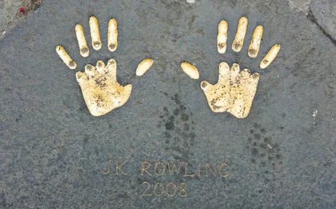 Handprints on Edinburgh pavement from 2008, part of city exploration game.