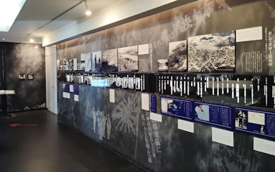 Naha WWII Navy Underground HQ exhibit with historical photos and information panels.