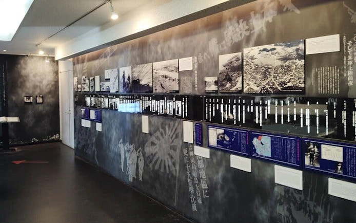 Naha WWII Navy Underground HQ exhibit with historical photos and information panels.