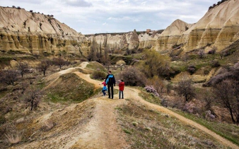 Trekking through scenic valleys and rock formations in Cappadocia.
