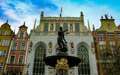 Neptune Fountain in front of Artus Court, Gdansk Old Town, on self-guided audio walking tour.
