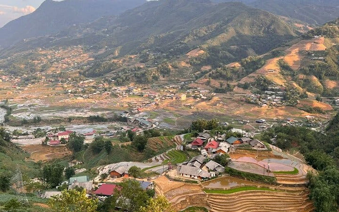 Sapa rice terraces and village view from motorbike tour in Vietnam.