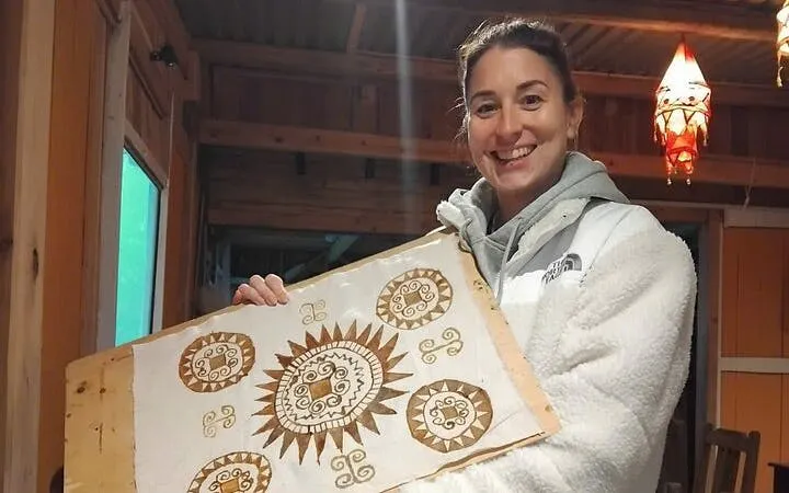 Batik artwork held by participant at Hmong artisan workshop in Ta Van.
