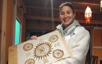 Batik artwork held by participant at Hmong artisan workshop in Ta Van.