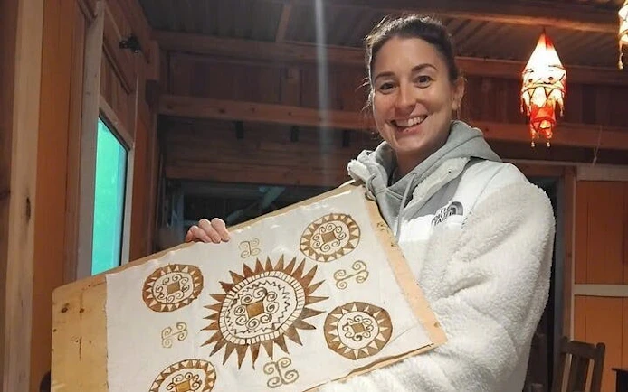 Batik artwork held by participant at Hmong artisan workshop in Ta Van.
