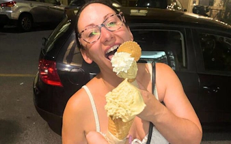 Woman enjoying gelato during Oltrarno Artisan Walking Tour in Florence.