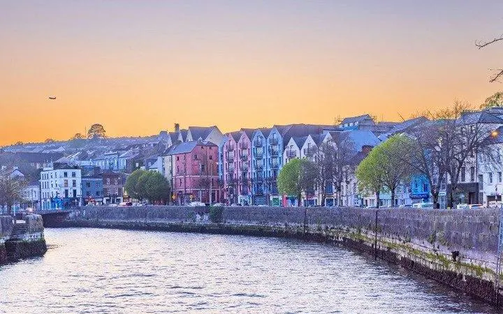 Colorful buildings along the River Lee at sunset, Cork, Ireland.
