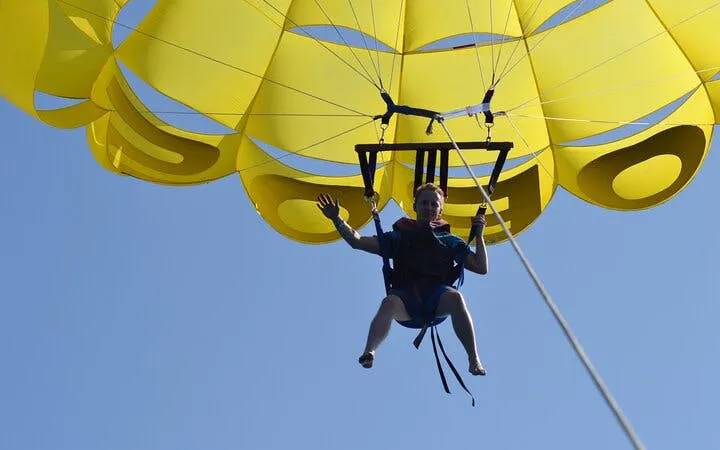 Parasailing over the Red Sea with a yellow parachute in Hurghada.