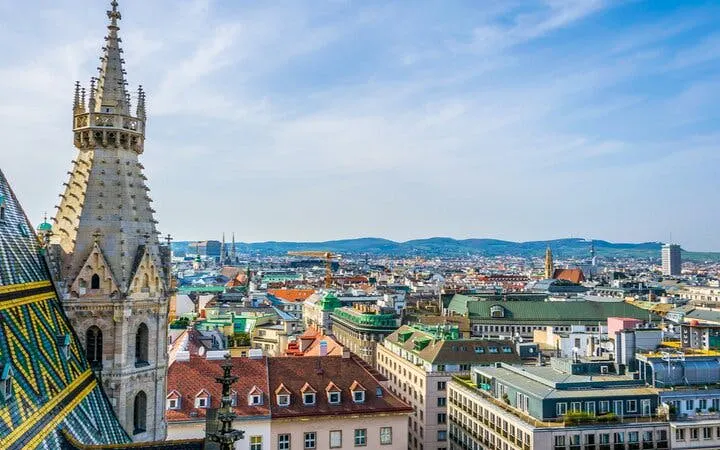 St. Stephen's Cathedral spire overlooking Vienna cityscape, Austria.