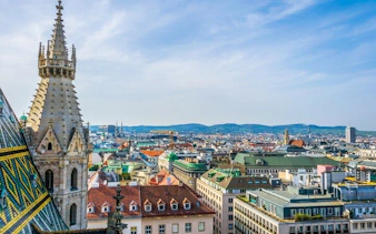 St. Stephen's Cathedral spire overlooking Vienna cityscape, Austria.