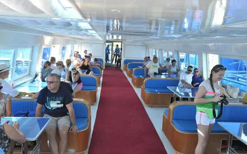 Interior of a semi-submarine with tourists seated, Hurghada sea trip.
