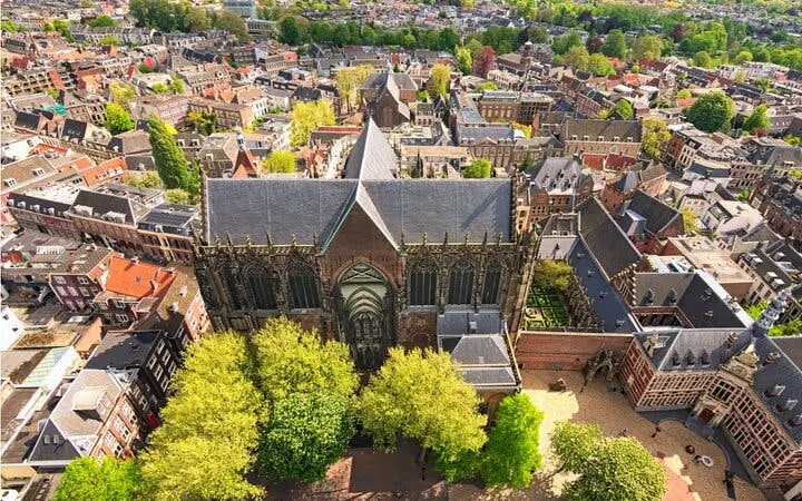 Utrecht aerial view featuring Dom Tower and historic cityscape for self-guided exploration game.