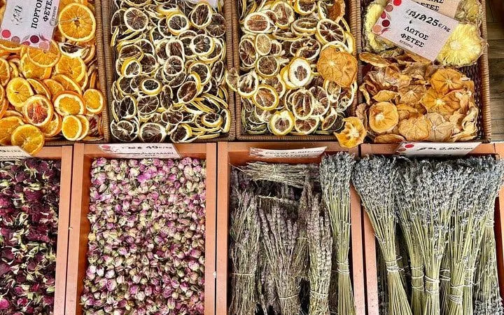 Dried fruits and herbs displayed at a market in Athens during a historic food walk.