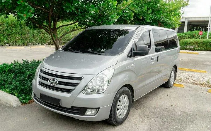Silver van for Punta Cana private airport transfer with meet-and-greet service.