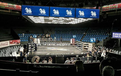 Ringside view of Muay Thai boxing ring at Rajadamnern Stadium, Bangkok.