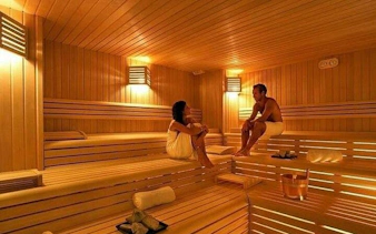 Couple enjoying sauna session at Alanya Hamam, part of Turkish bath rituals experience.