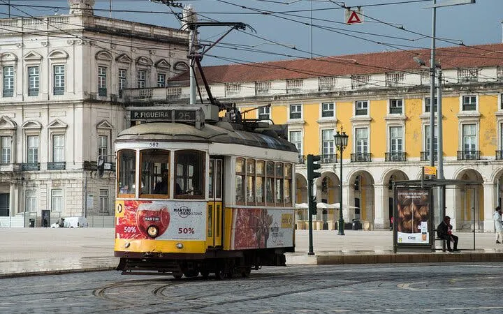 Lisbon tram in Praça do Comércio during a private historical city tour.