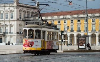 Lisbon tram in Praça do Comércio during a private historical city tour.