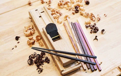 Chopstick-making tools and wood shavings at Kyoto Arashiyama workshop.