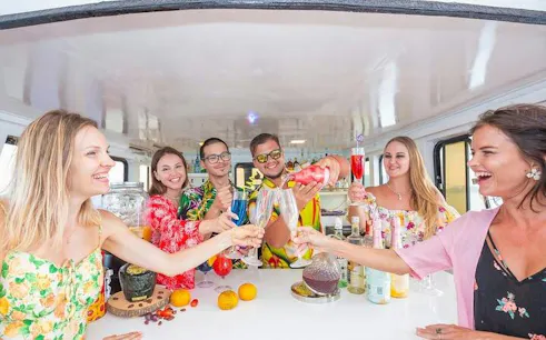 Group enjoying drinks on a Melody Cruise with BBQ buffet, Phuket.