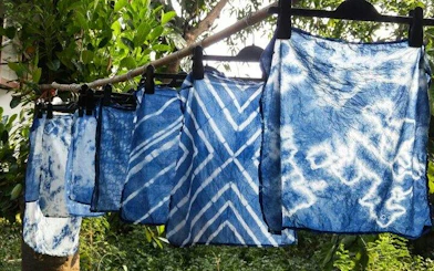 Indigo-dyed fabrics drying on a line at Sapa Indigo Dyeing Workshop, Ta Van Village, Sa Pa.