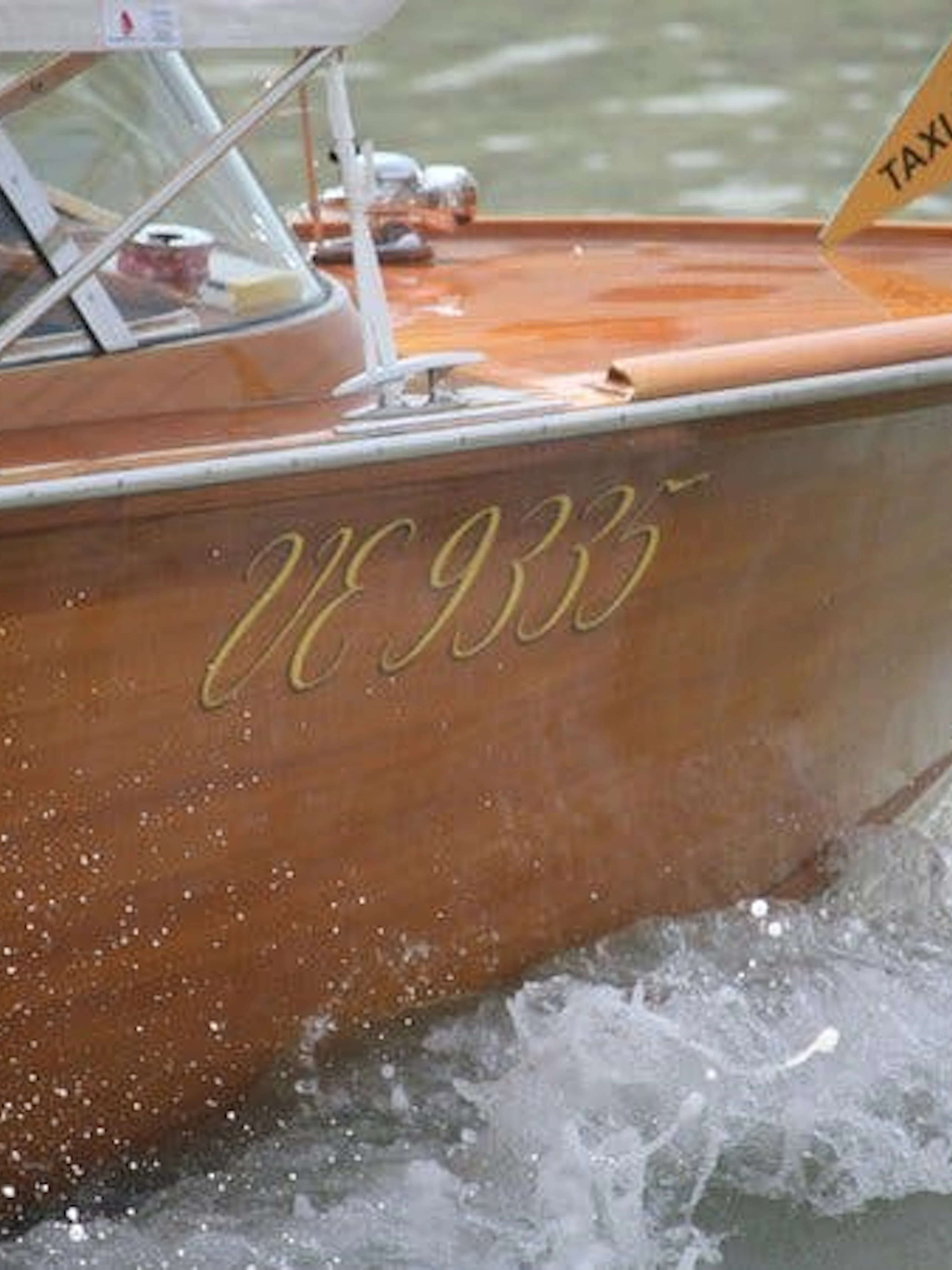 Water taxi on canal for Murano Glass Factory tour in Venice.
