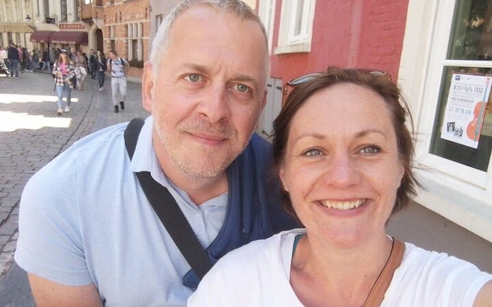 Couple enjoying a self-guided city exploration game in Bruges.