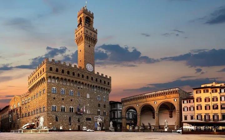Palazzo Vecchio and Loggia dei Lanzi at sunset, Florence self-guided walking tour.