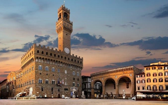 Palazzo Vecchio and Loggia dei Lanzi at sunset, Florence self-guided walking tour.