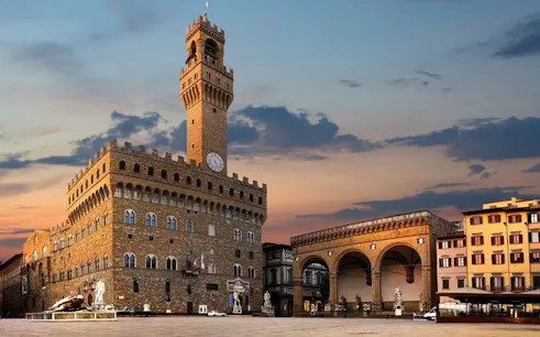 Palazzo Vecchio and Loggia dei Lanzi at sunset, Florence self-guided walking tour.