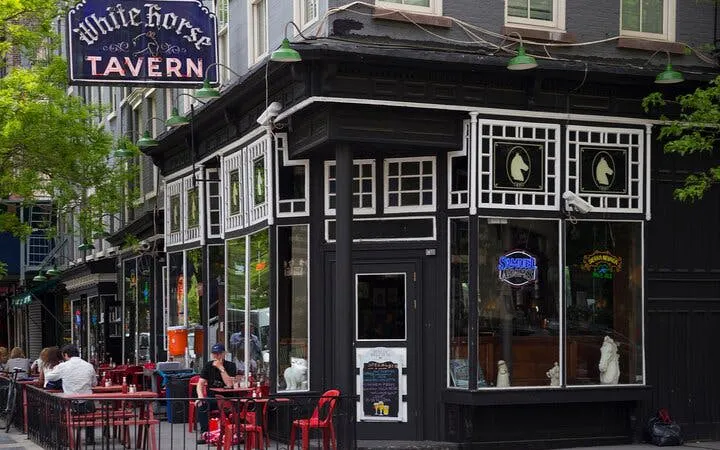 White Horse Tavern exterior with outdoor seating, Manhattan exploration game location.