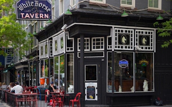 White Horse Tavern exterior with outdoor seating, Manhattan exploration game location.