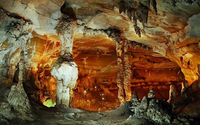 Cave interior with stalactites and stalagmites on Sapa Trekking Tour, Ta Phin Village.