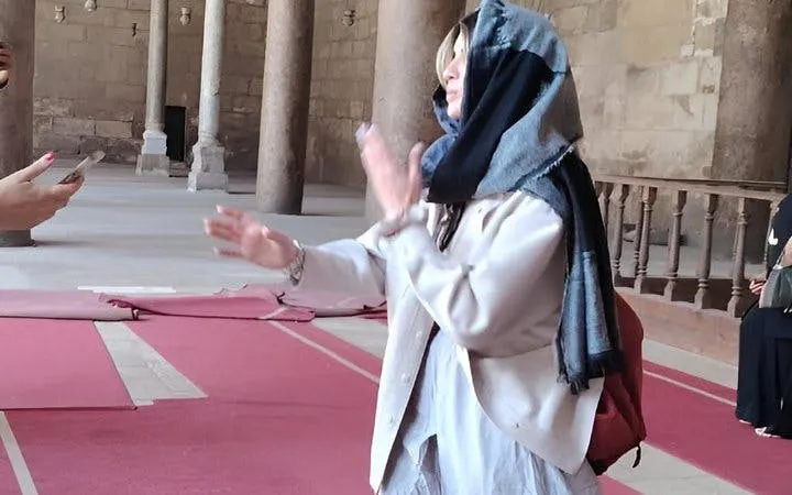 Visitor exploring the interior of the Citadel of Saladin in Cairo.