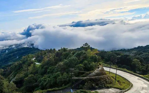 Doi Inthanon National Park view with winding road and clouds, Chiang Mai.