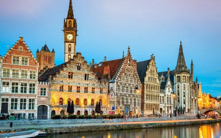 Historic buildings along the Graslei canal in Ghent during a self-guided walking tour.
