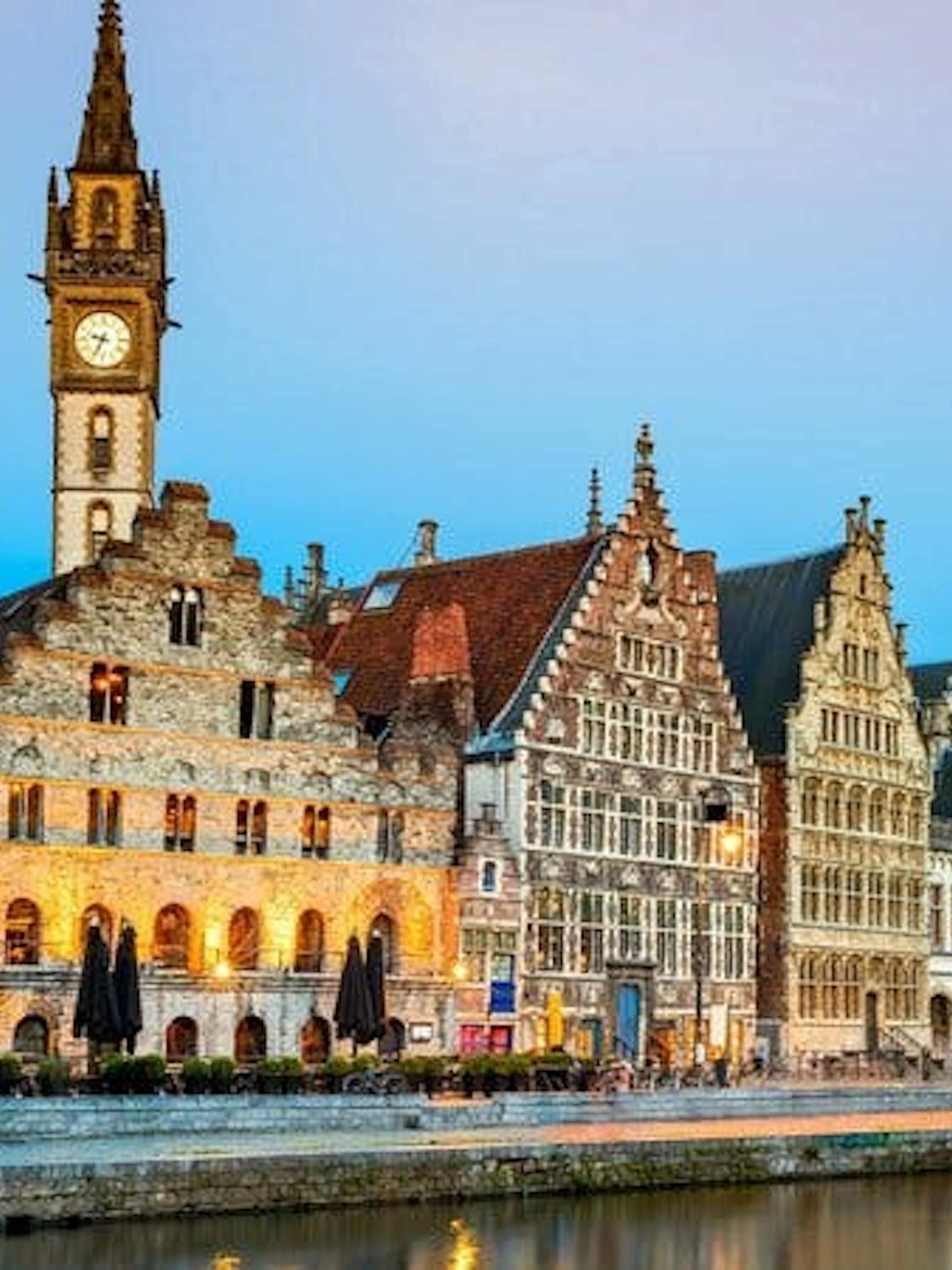 Historic buildings along the Graslei canal in Ghent during a self-guided walking tour.