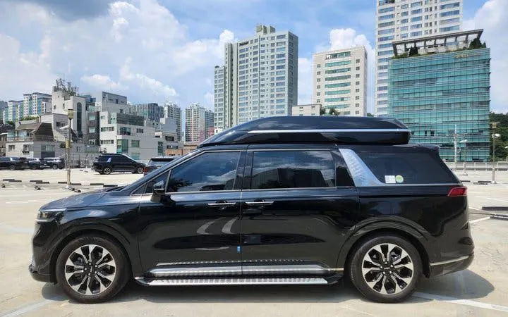 Black minivan parked in urban area, Korea, for private city tour with flexible itinerary.