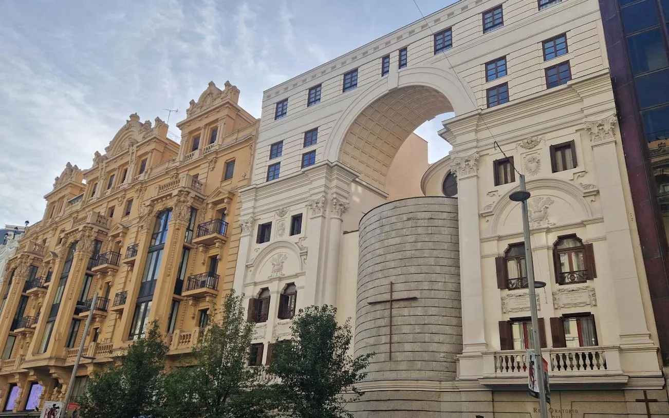 Gran Vía architecture featuring ornate facades and modern structures in Madrid.
