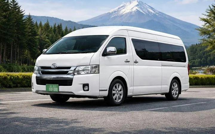 White charter van for Kyoto private tour with Mount Fuji in the background.