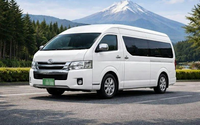 White charter van for Kyoto private tour with Mount Fuji in the background.