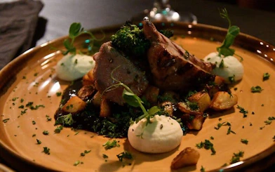 Grilled lamb with potatoes and greens at a private family-owned restaurant in Iceland.