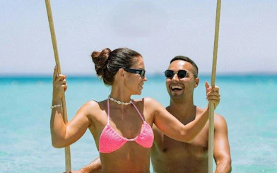 Couple enjoying a private speedboat trip on clear waters near Hula Hula Island, Hurghada.