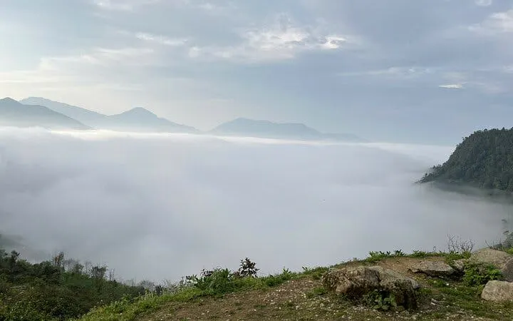 Fog-covered mountains in Sapa during a guided motorbike tour of Ta Phin, Ngu Chi Son, and Ban Khoang villages.