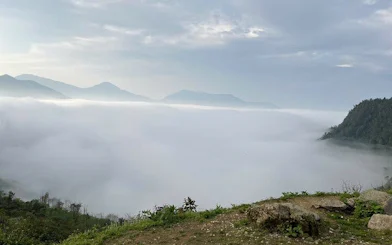Fog-covered mountains in Sapa during a guided motorbike tour of Ta Phin, Ngu Chi Son, and Ban Khoang villages.