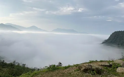 Fog-covered mountains in Sapa during a guided motorbike tour of Ta Phin, Ngu Chi Son, and Ban Khoang villages.