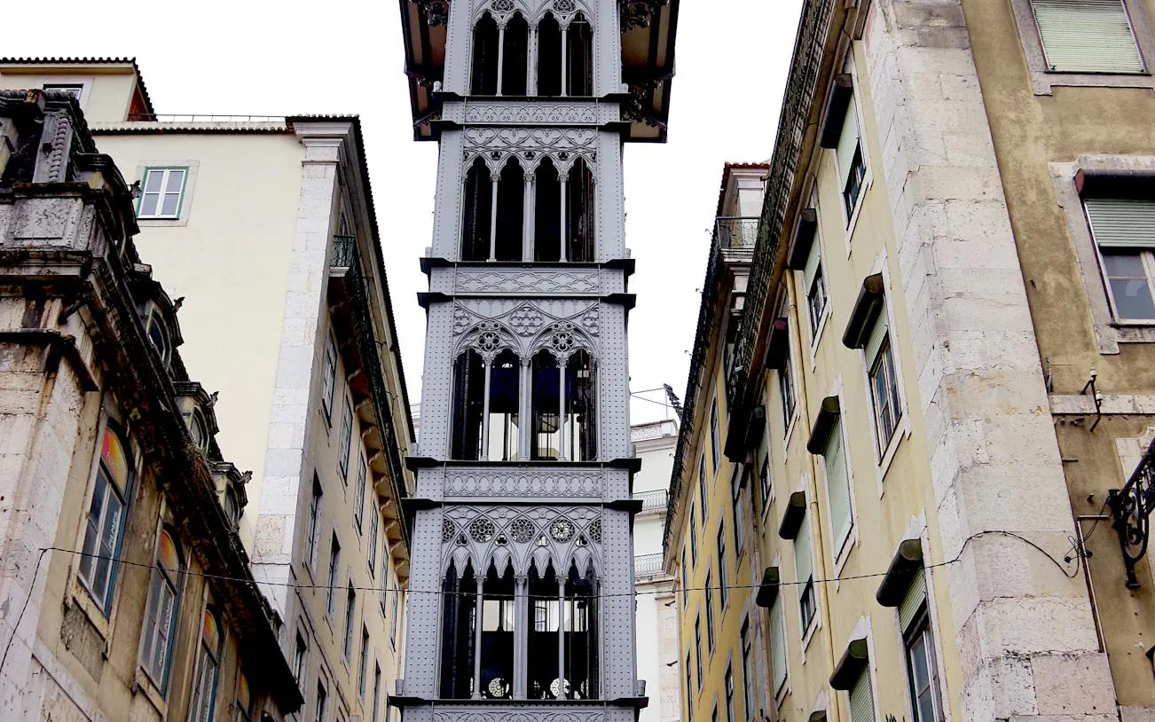 Santa Justa Lift between buildings in Lisbon Baixa, part of self-guided audio walking tour.